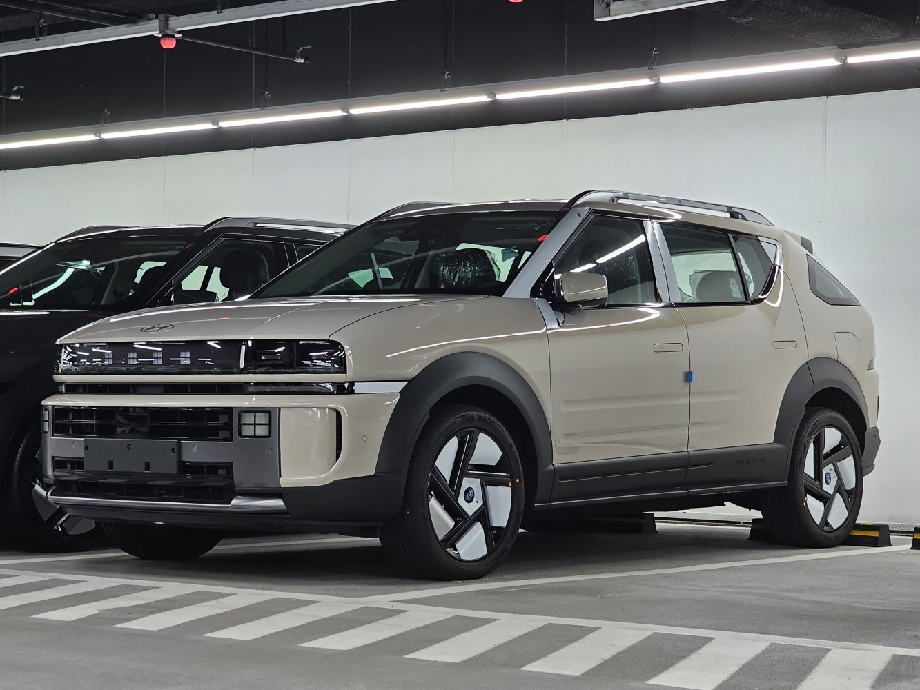 Futuristic front and side view of an SUV with unique LED lights and aerodynamic design