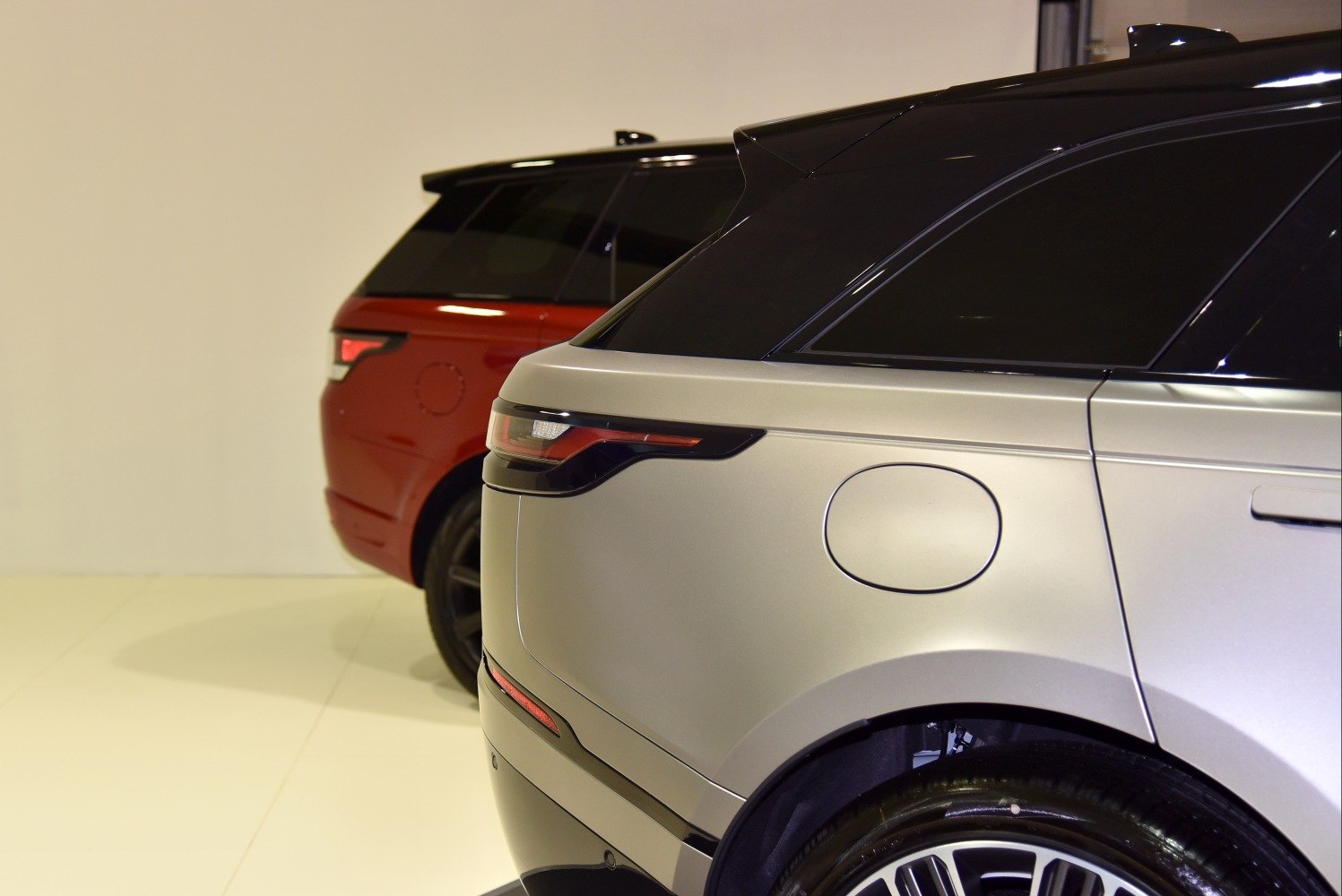 Rear tail lights and window design of two SUVs