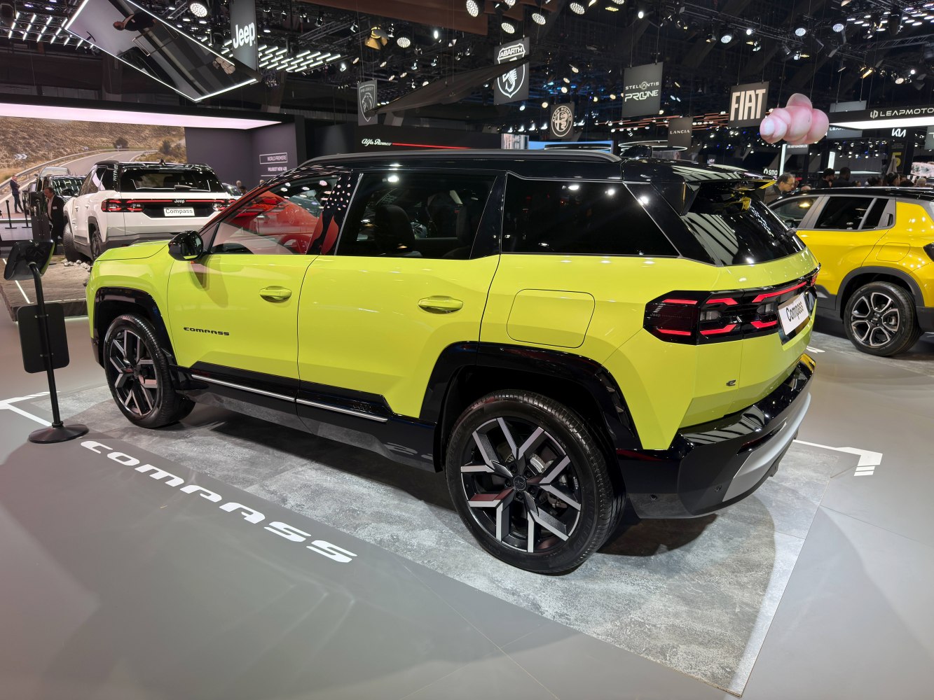 Rear three-quarter view and taillights of an SUV in lime green.