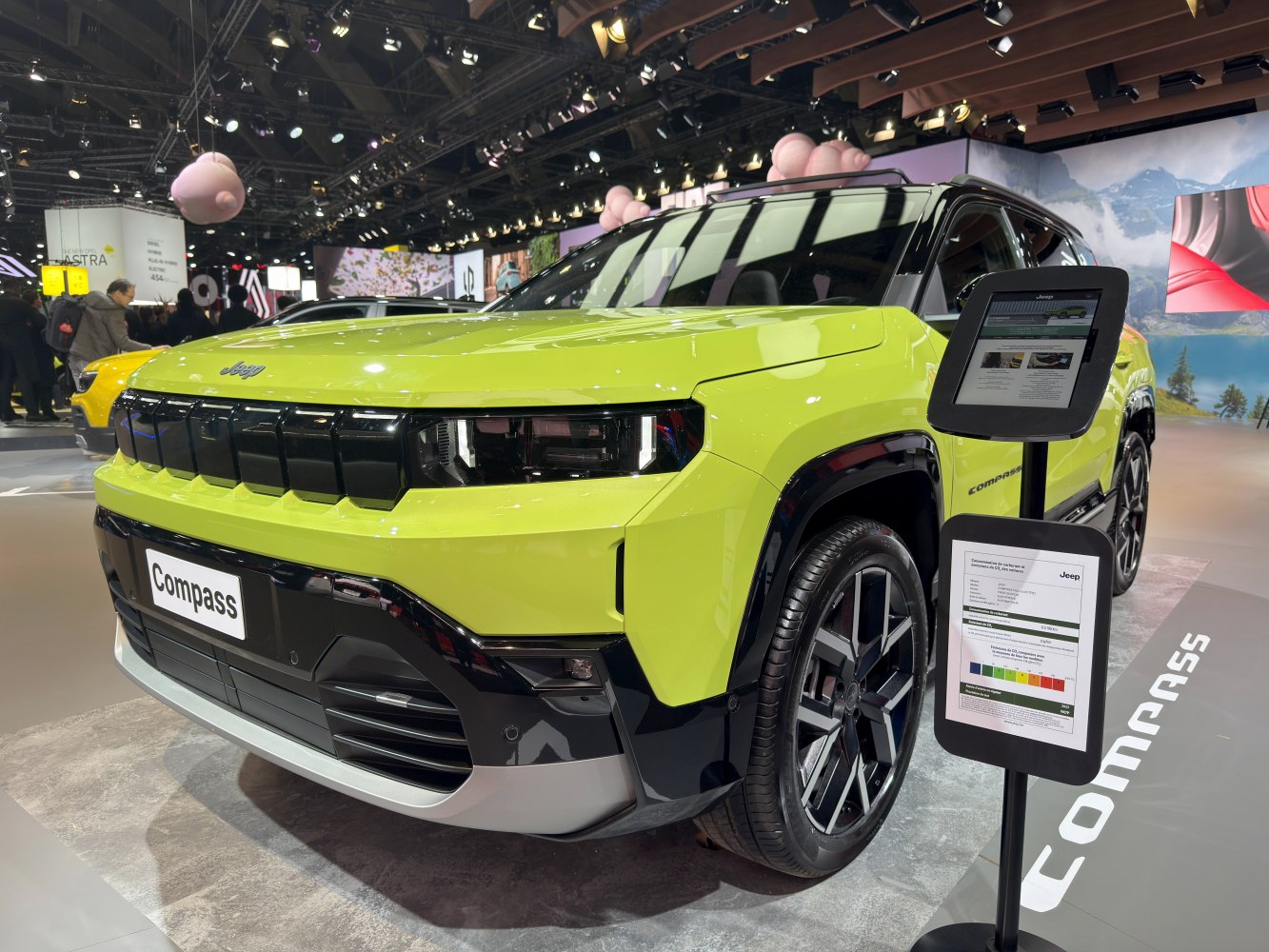 Front grille and alloy wheel design of lime green SUV