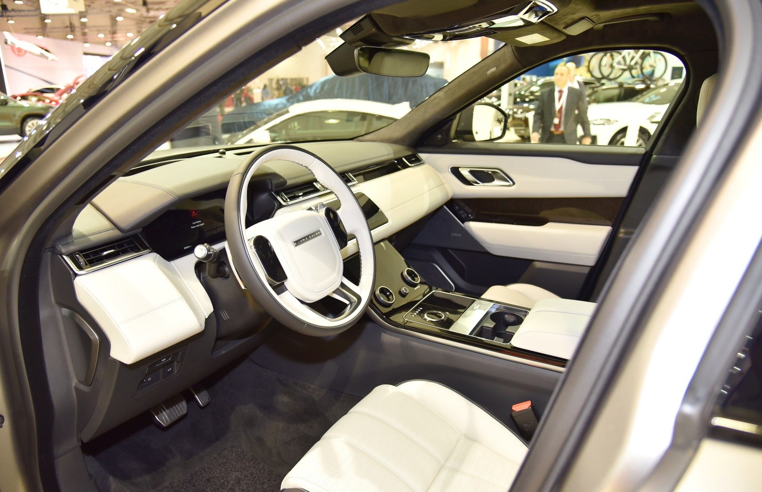 Luxury SUV interior with white leather seats and modern dashboard