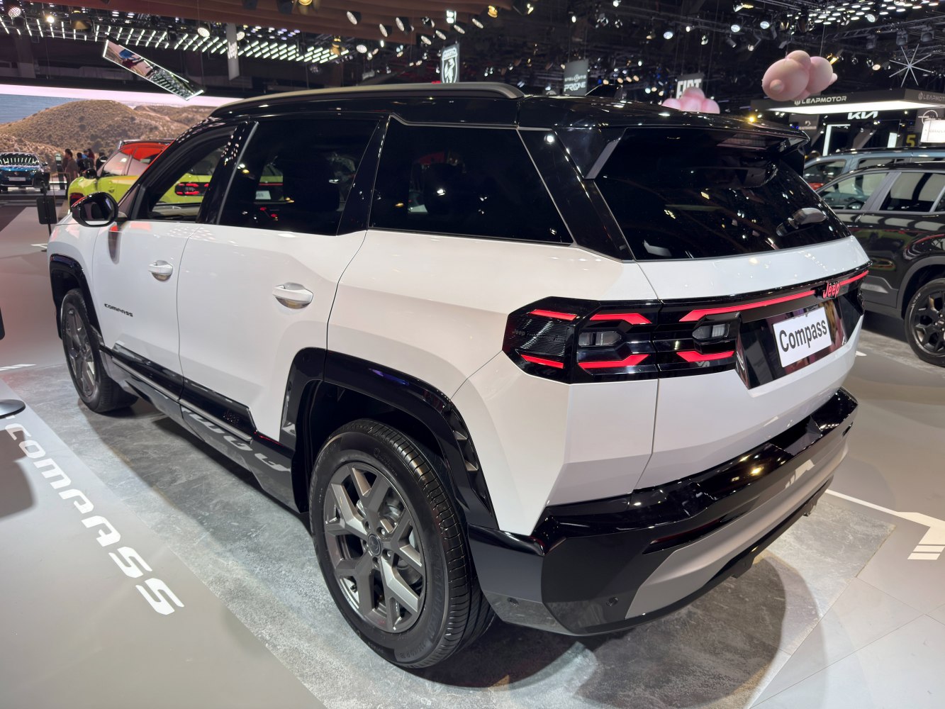 SUV rear profile with LED taillights and two-tone black-white body