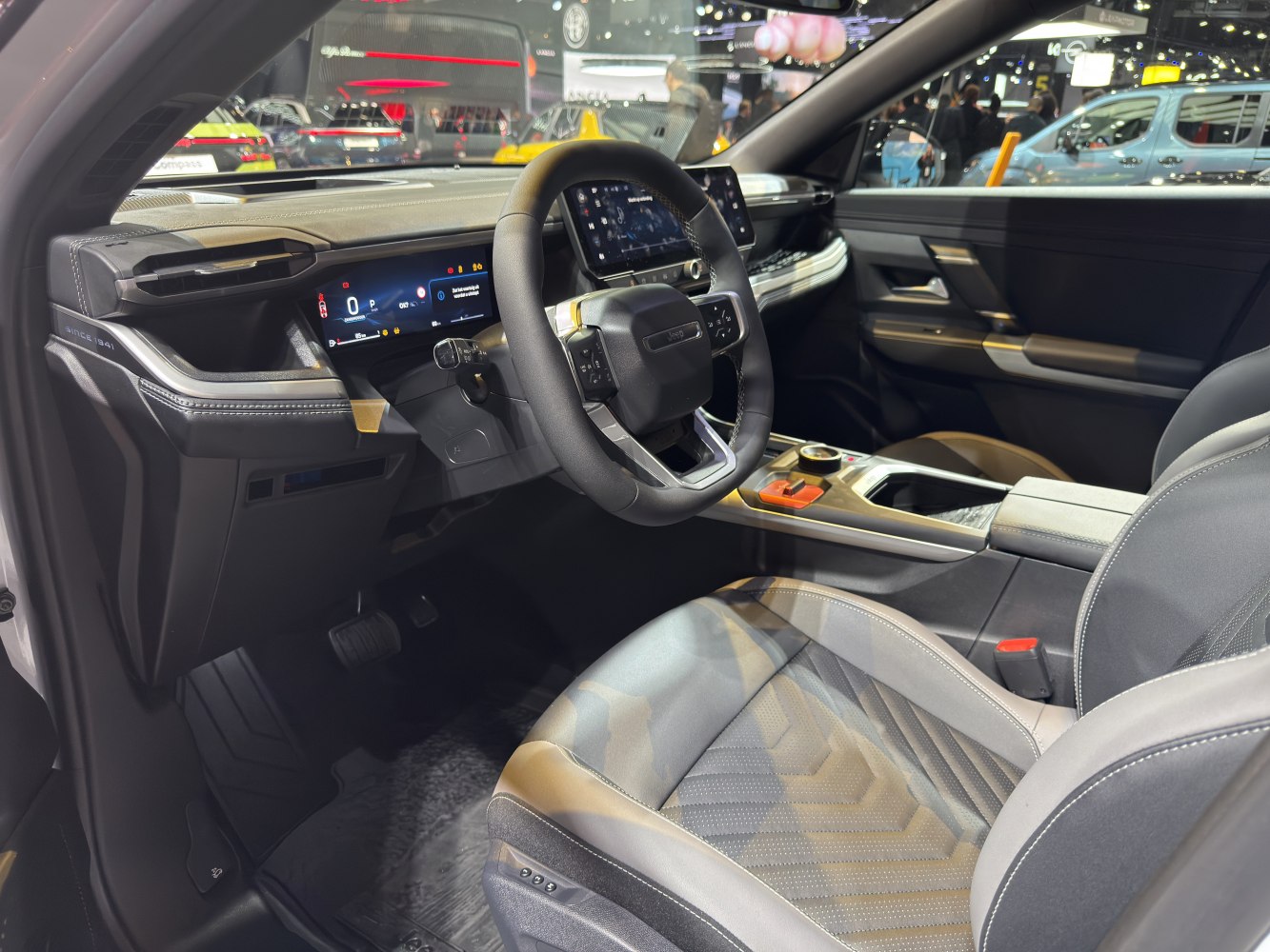 Digital dashboard and sporty steering wheel in car interior