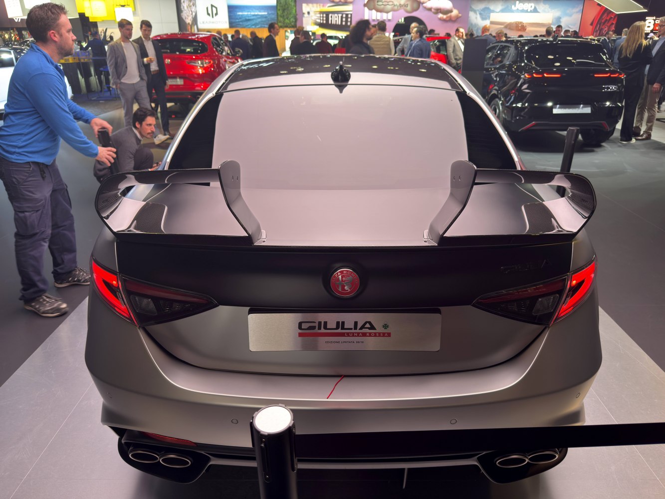 Rear view with carbon fiber rear wing and quad exhaust tips