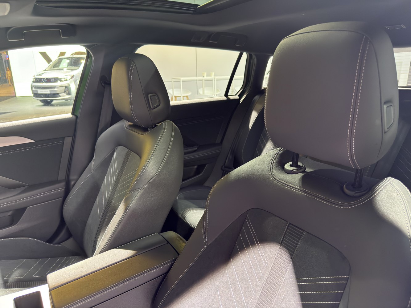 Detailed front seats with premium stitching in a modern car interior