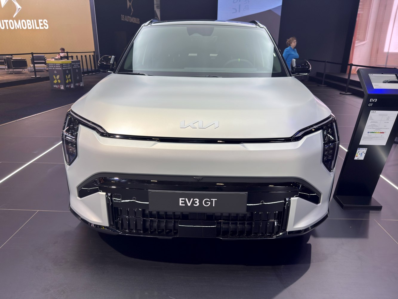 Front view of an electric SUV with sleek LED headlights and distinctive grille.