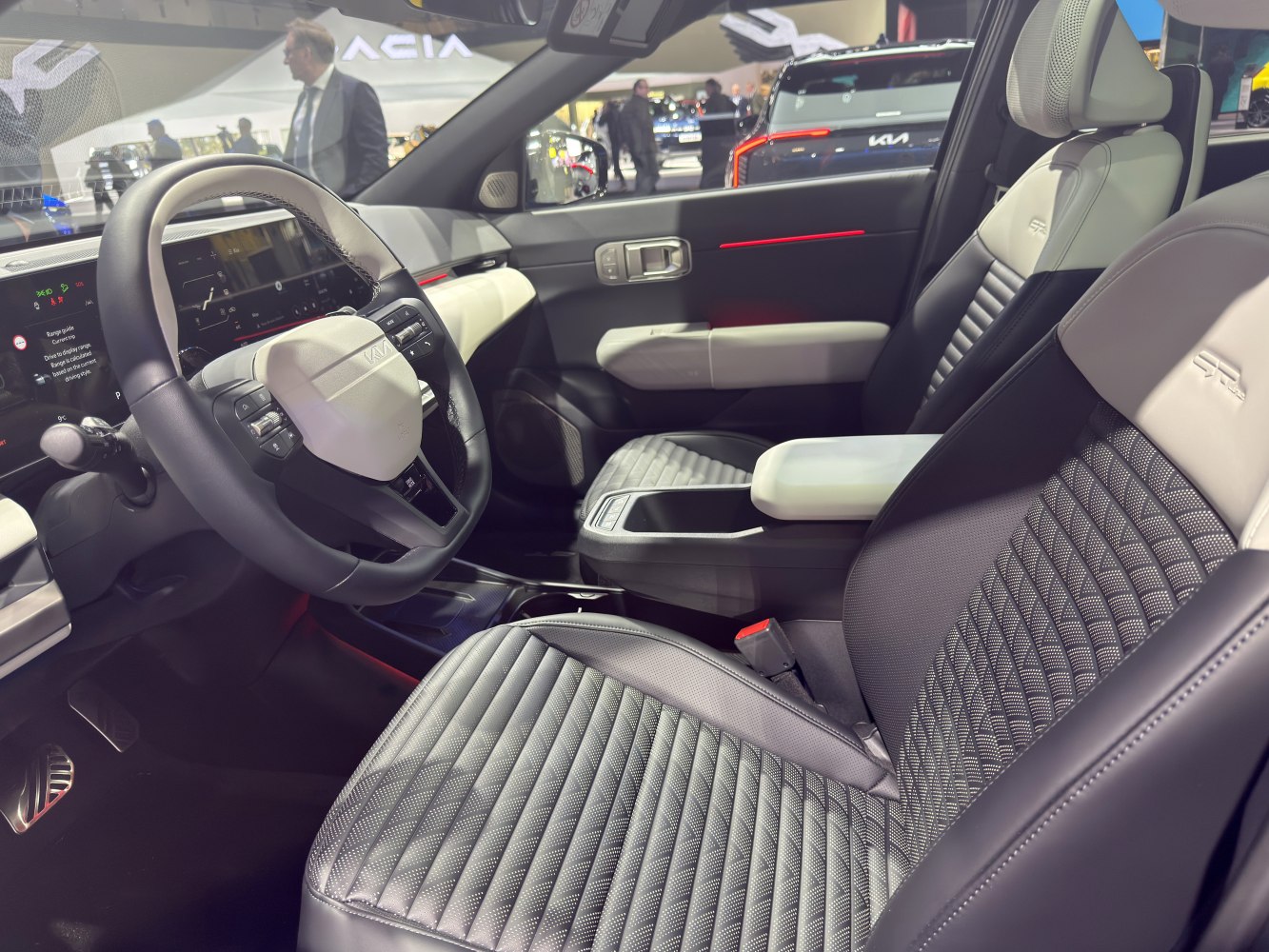 Luxury quilted seats and modern steering wheel with digital dashboard