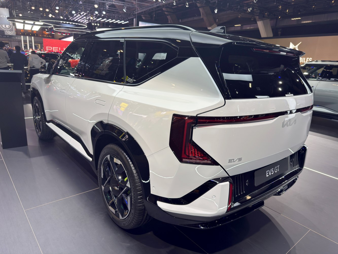 Electric SUV rear with geometric taillights and two-tone roof.