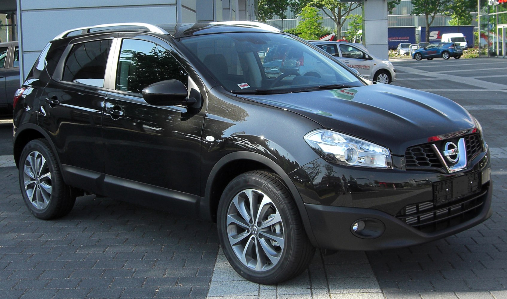 Front and side view with alloy wheels and signature headlights