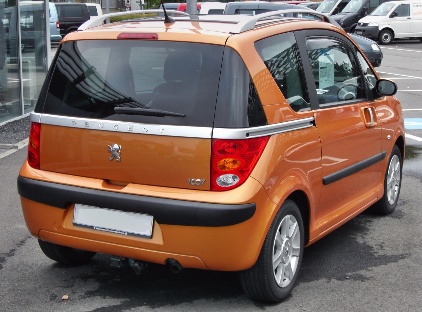 Rear view showing sliding doors and compact hatchback design