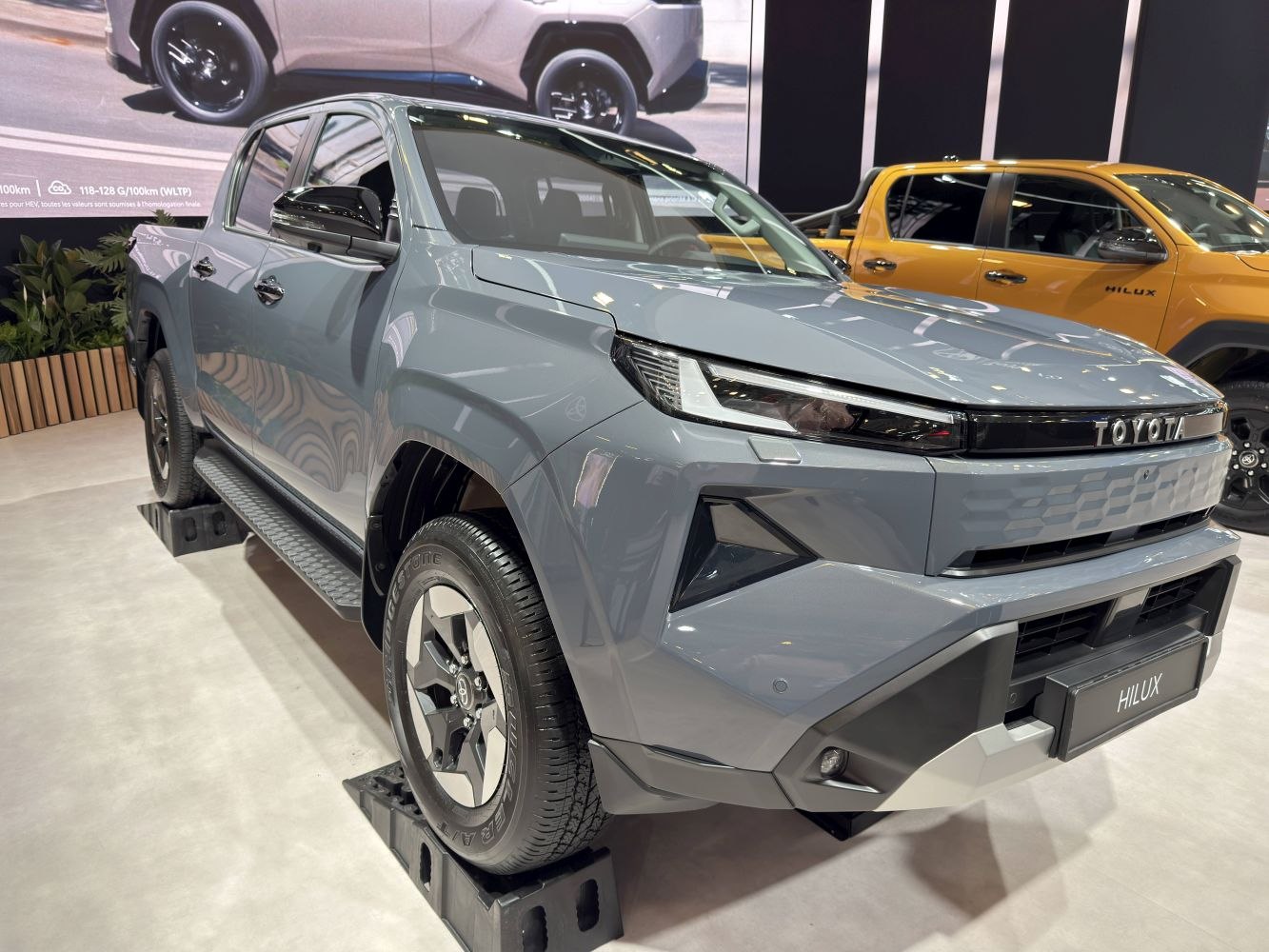 Front view of modern pickup truck with LED headlights and bold grille