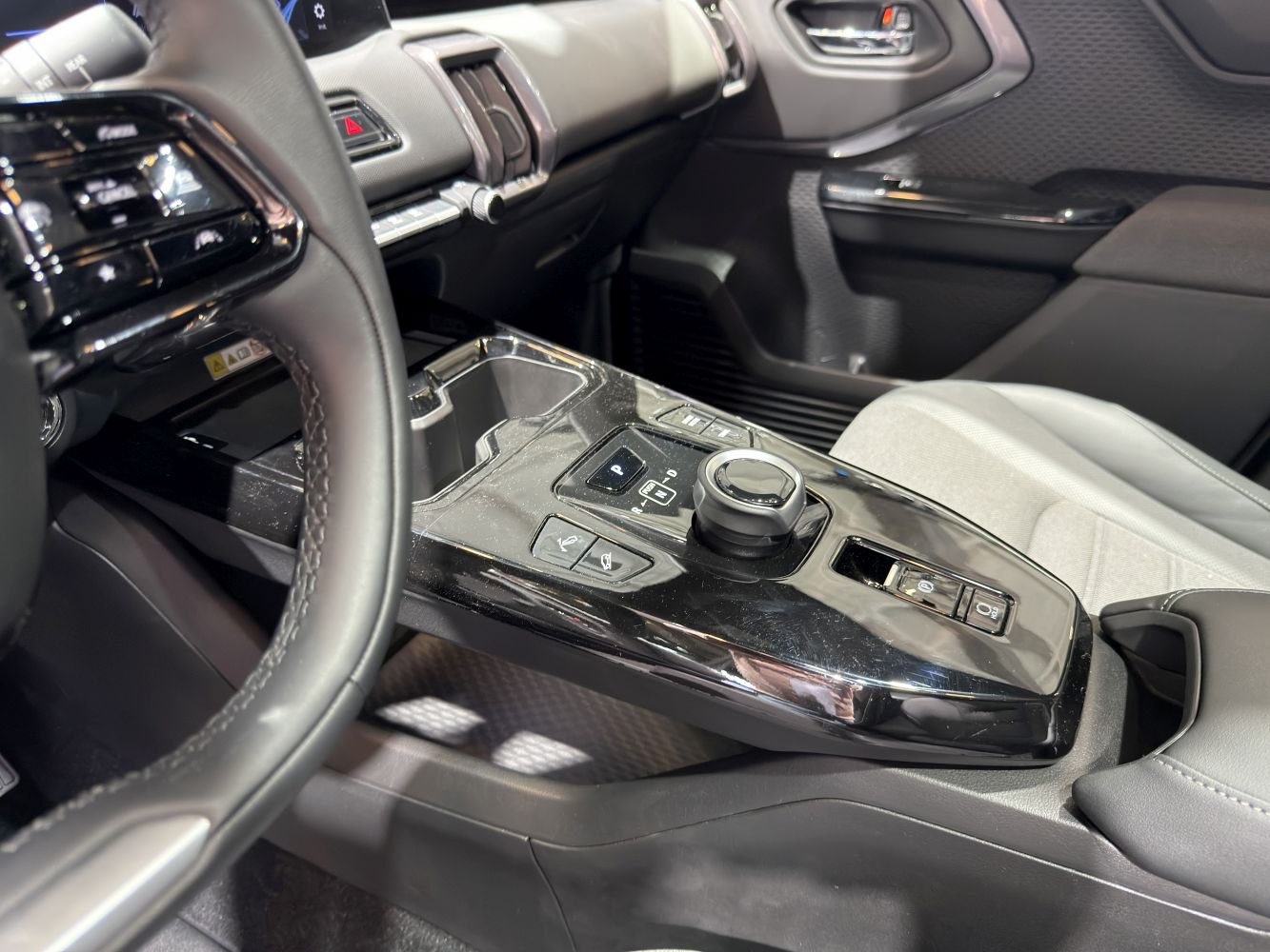Center console with rotary gear selector and electronic parking brake
