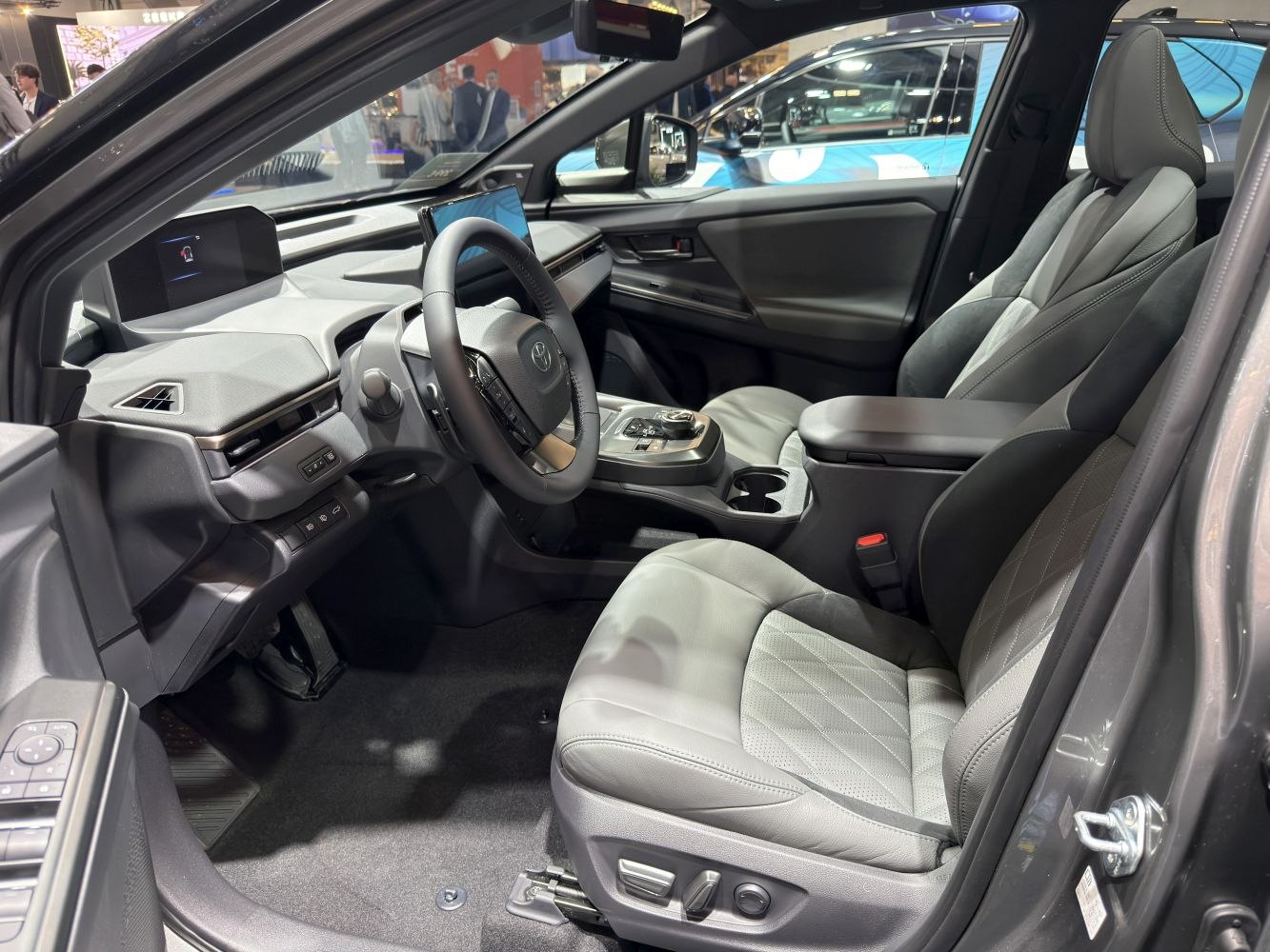Modern car interior with digital displays and premium seats