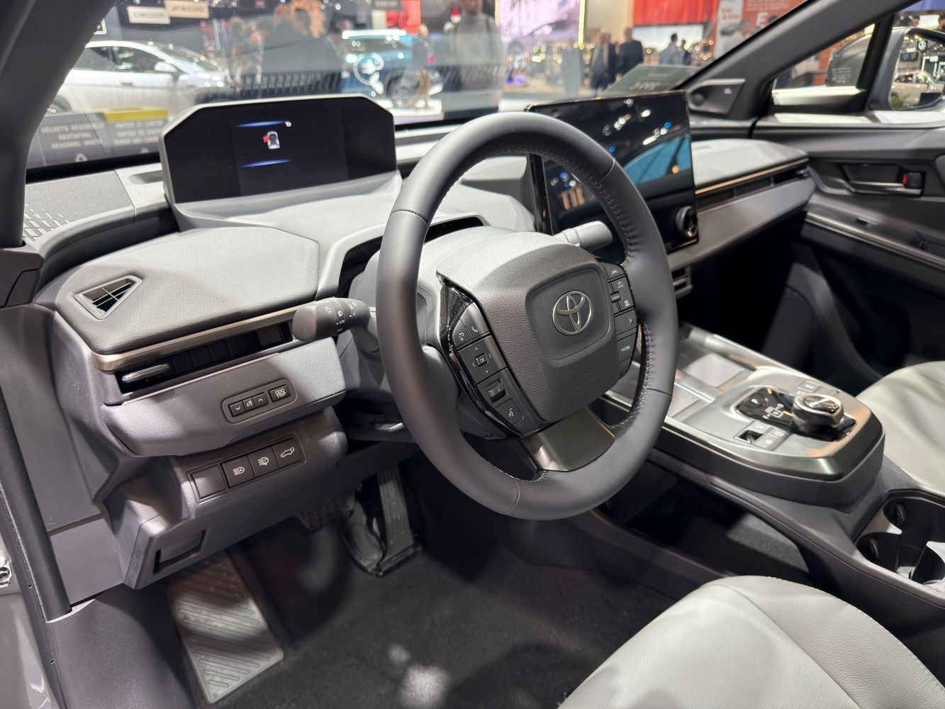Modern car interior cockpit with digital displays and steering controls