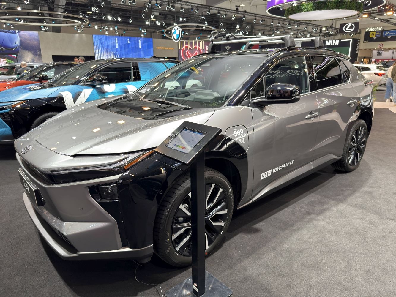Front side of electric SUV with LED lights and black roof accents