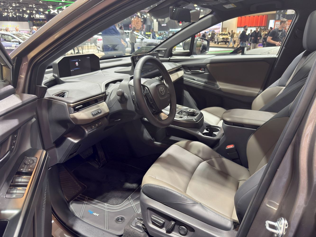 Modern electric SUV interior with digital dashboard and leather seats