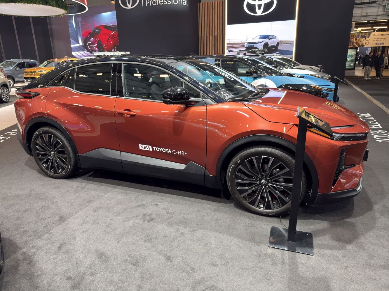 Side view of an electric SUV with black alloy wheels and angular headlights.