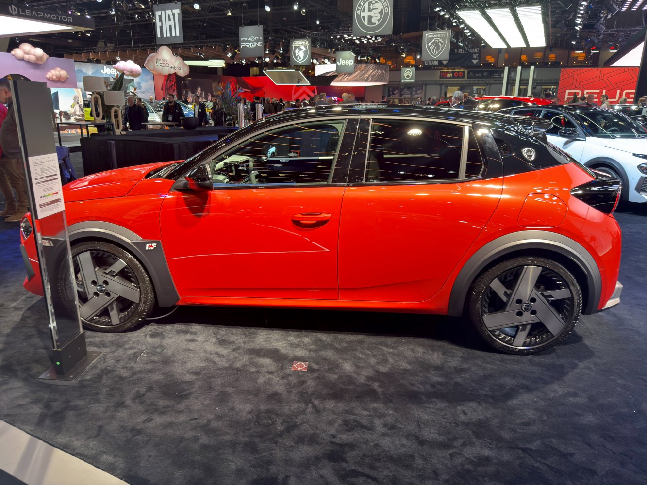 Compact hatchback side profile with black dual-tone roof and aerodynamic wheels