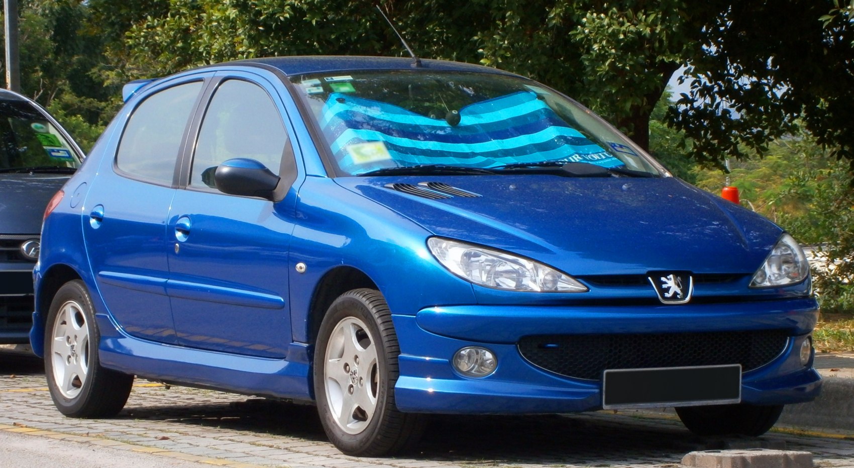 Blue hatchback showing front and side profile with aerodynamic design