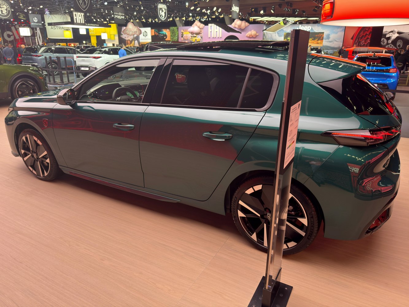 Side profile of sleek hatchback with distinct alloy wheels