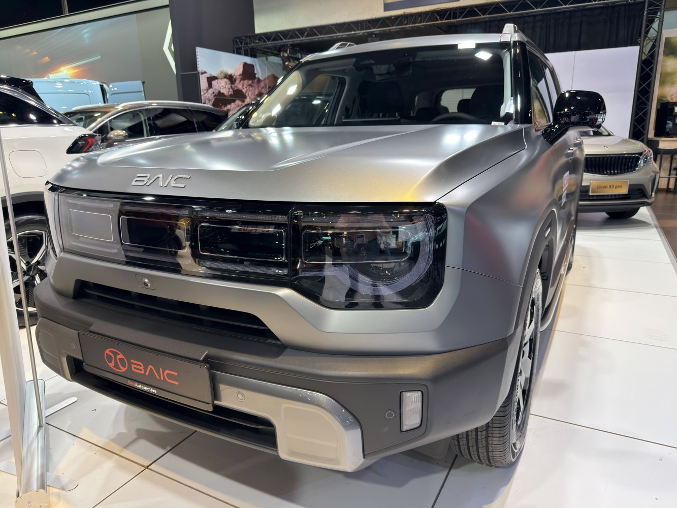 SUV front grille with modern headlight design and matte finish