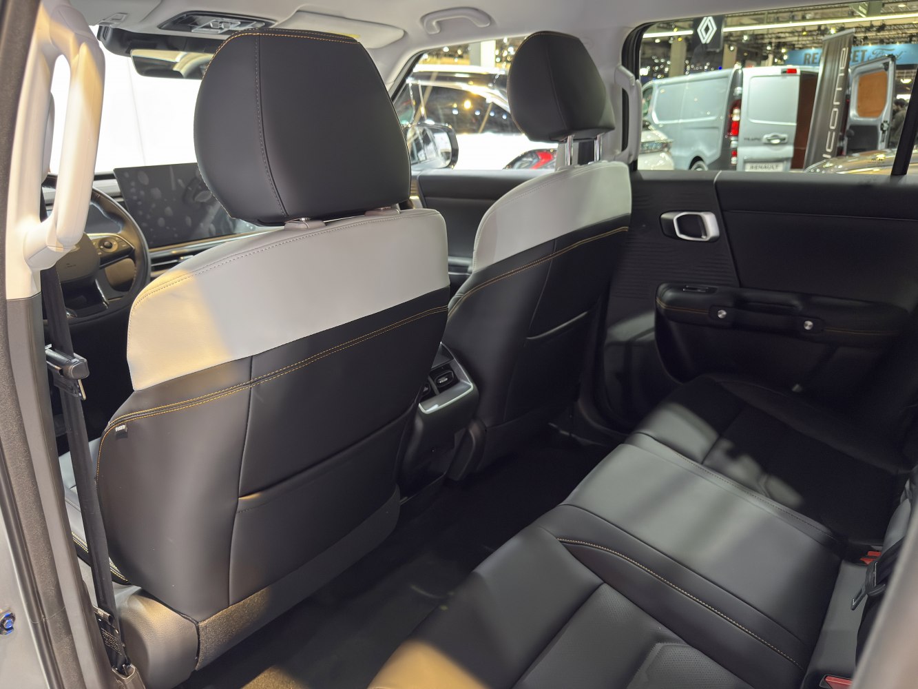 Spacious rear seats and modern two-tone upholstery with stitching.