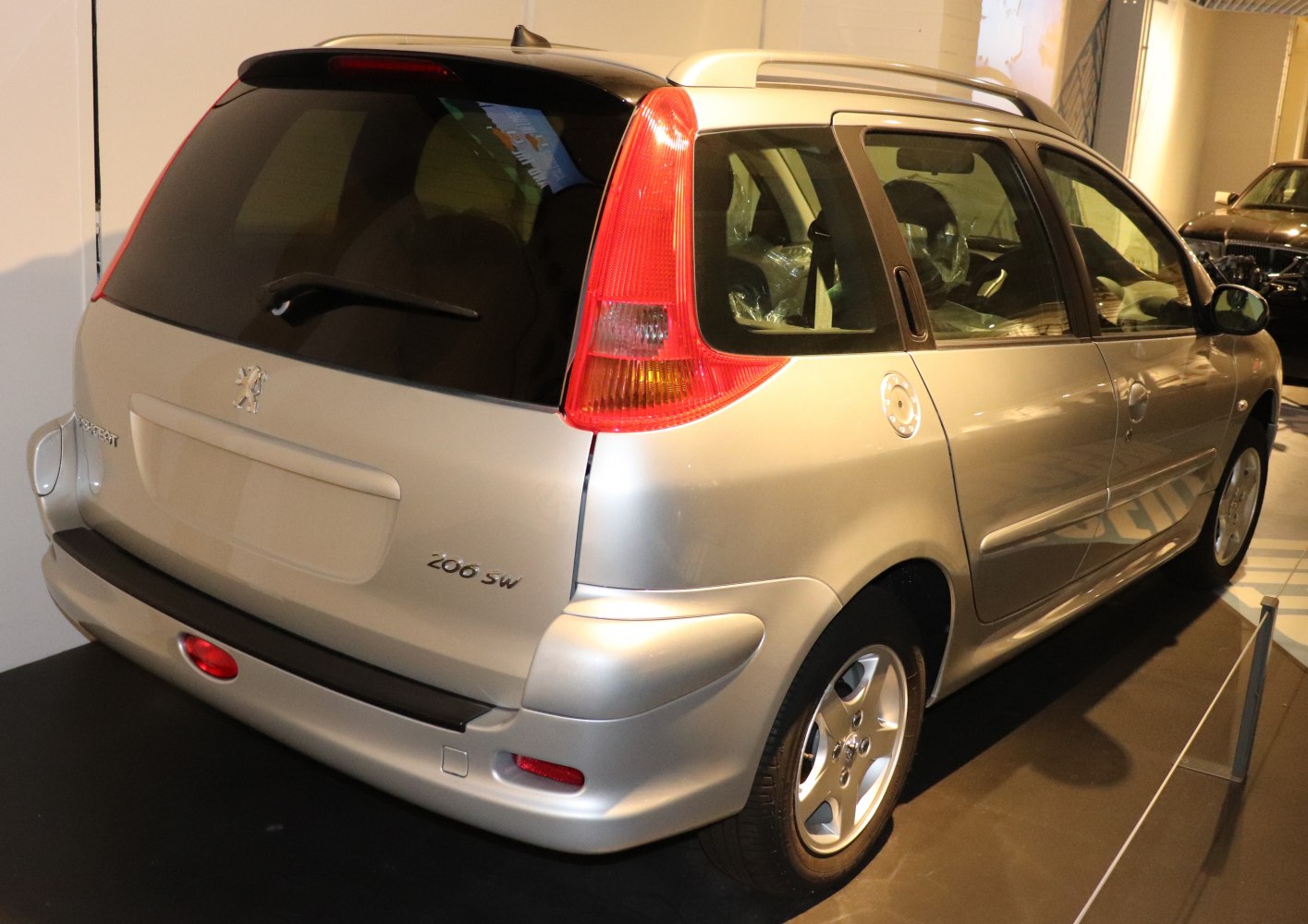 Rear view of a compact station wagon with vertical tail lights and rear window wiper