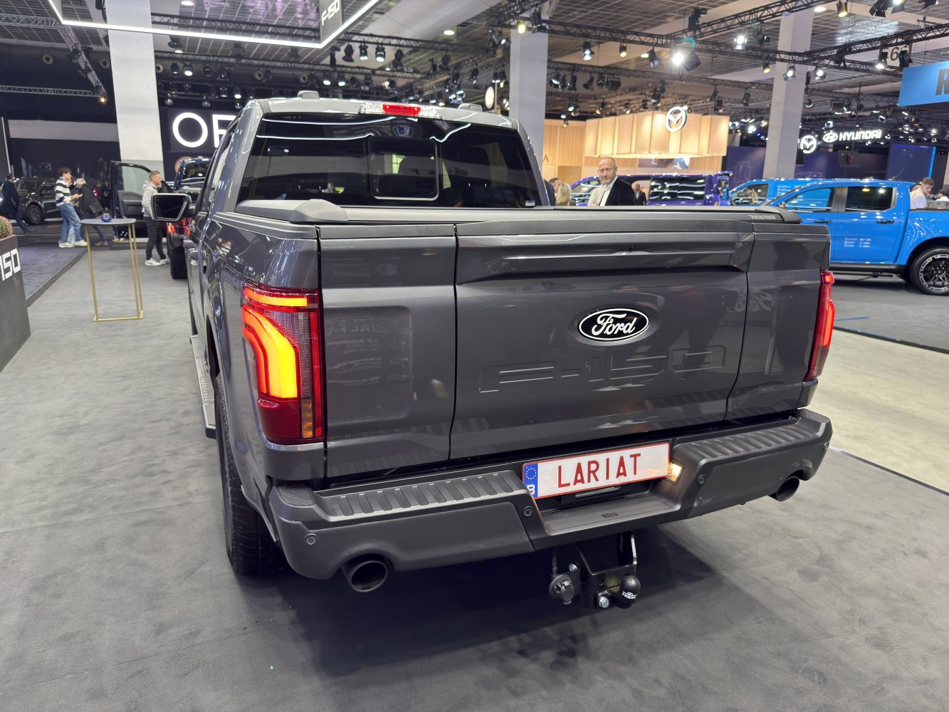 Rear view of pickup showcasing tailgate, Lariat trim badge, and LED tail lights