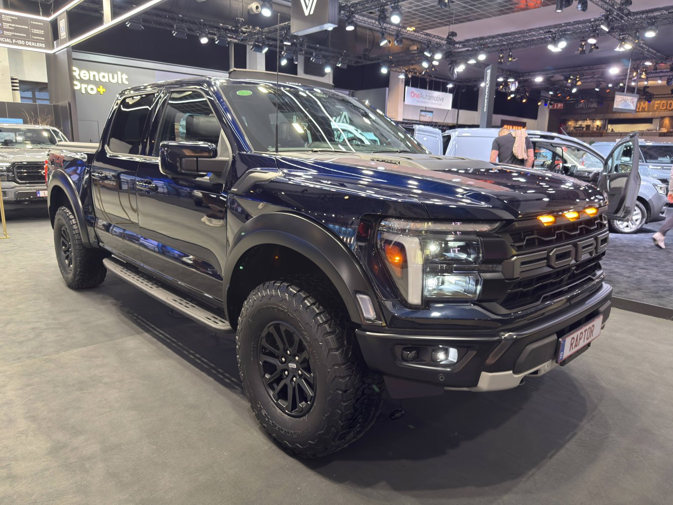 2024 rugged pickup with off-road tires and aggressive front grille