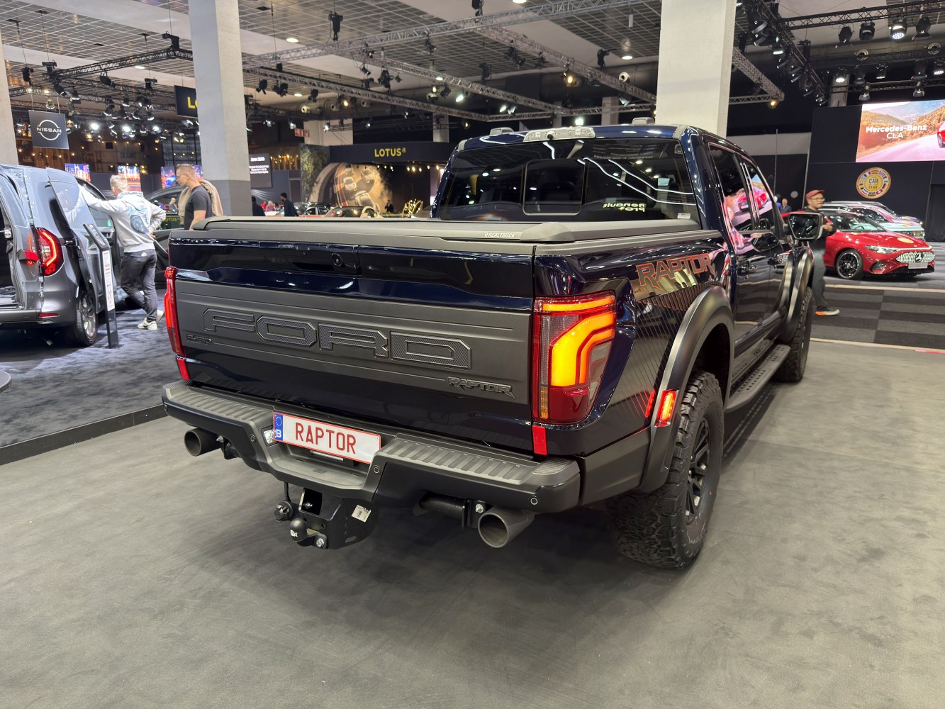 Rear view of 2024 pickup with tailgate, LED lights, and hitch