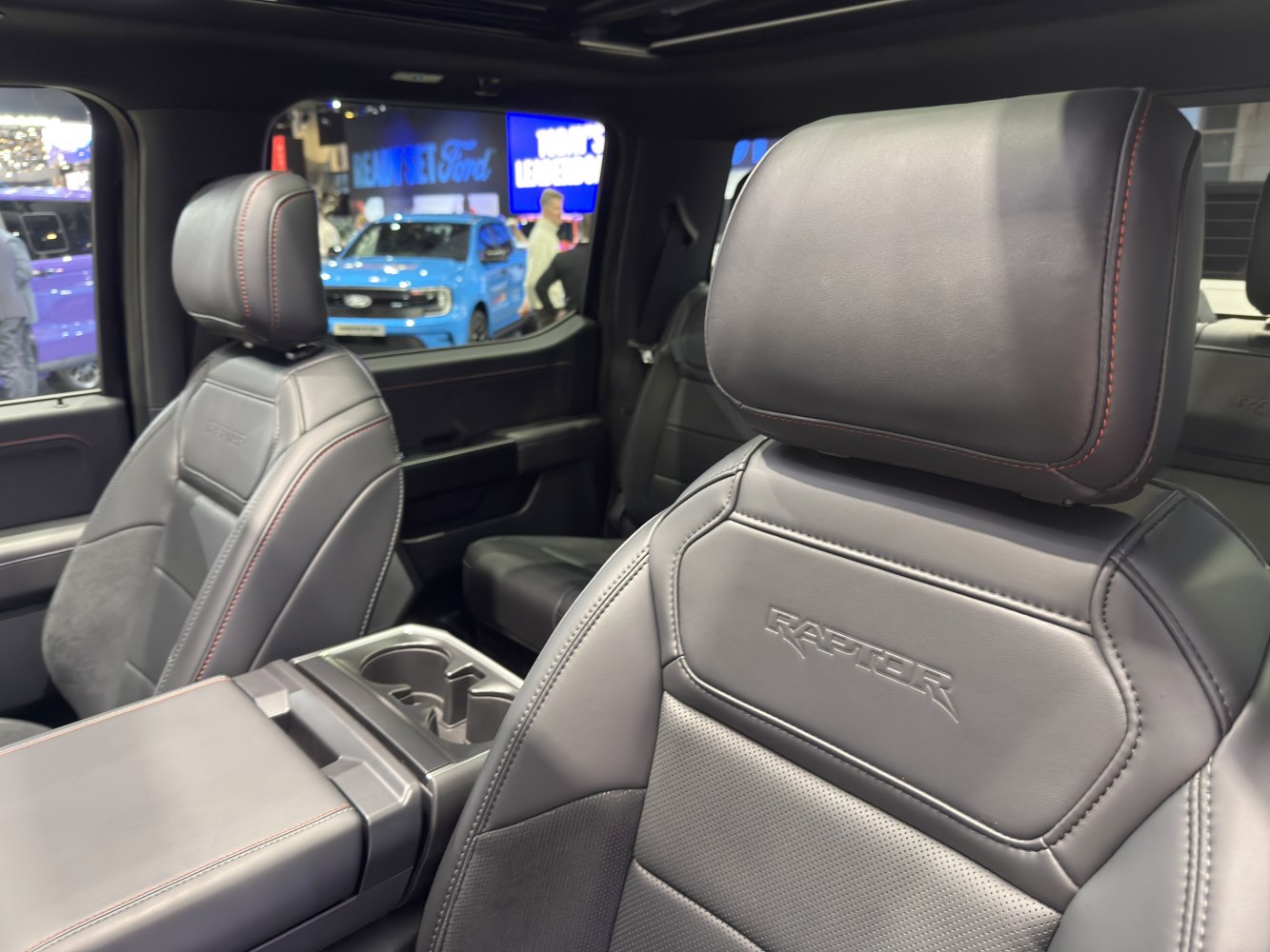 Premium leather seats with embossed RAPTOR branding in a pickup interior