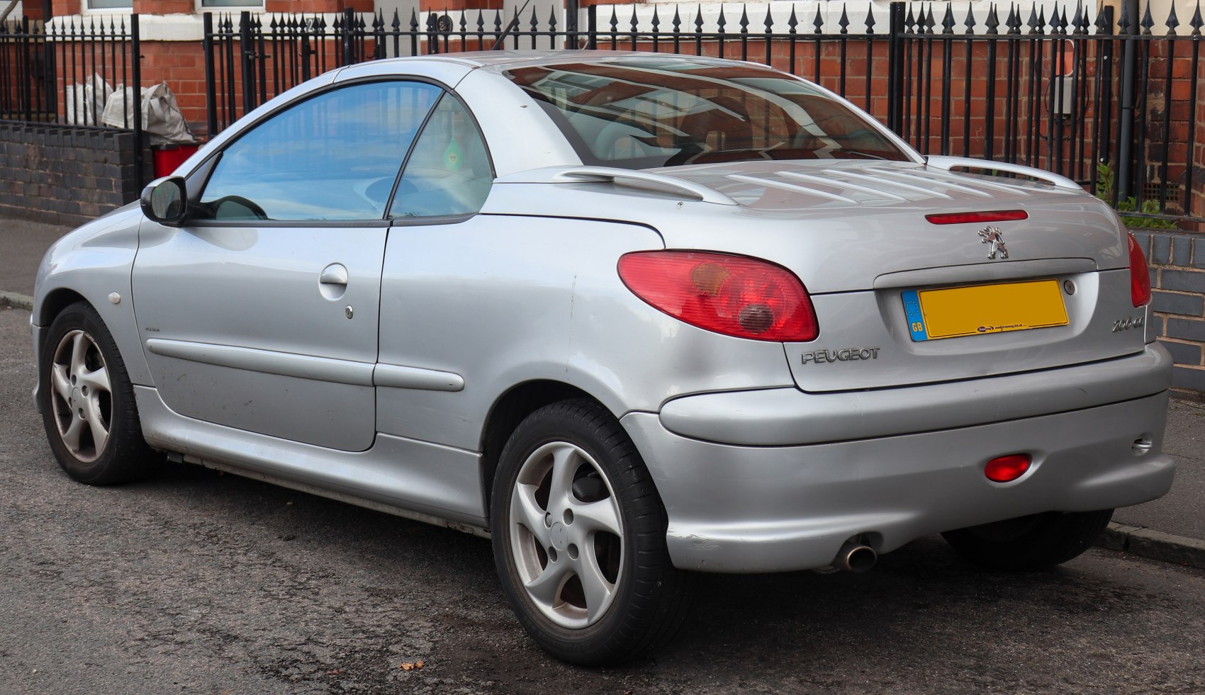 Silver convertible coupe rear view with alloy wheels