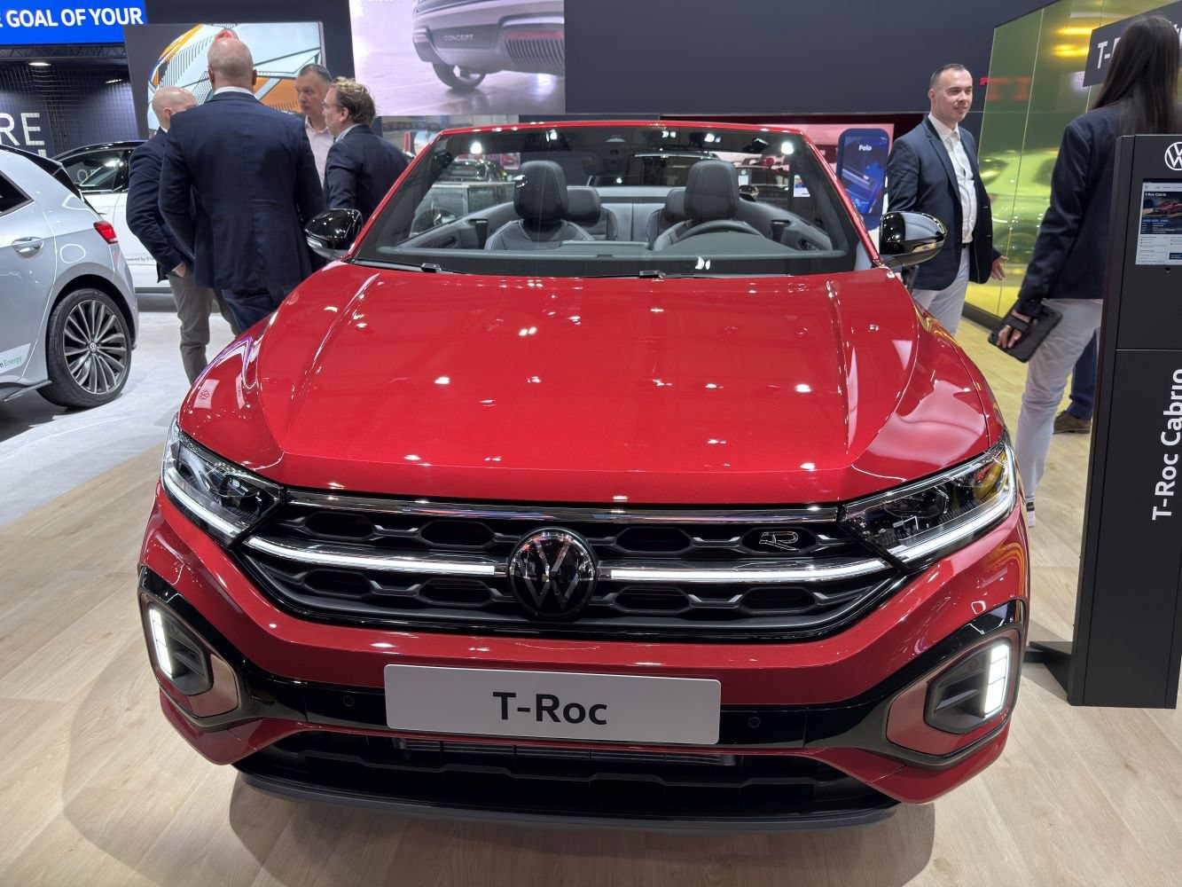 Front view of red convertible with grille and LED headlights