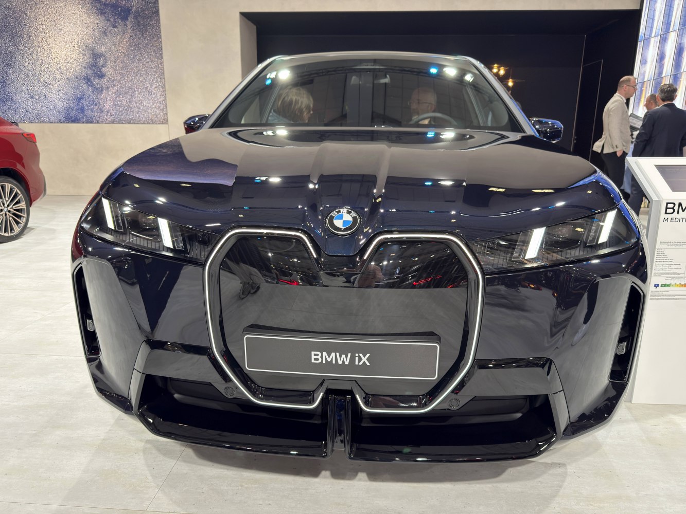 Front view with large kidney grille and modern headlights
