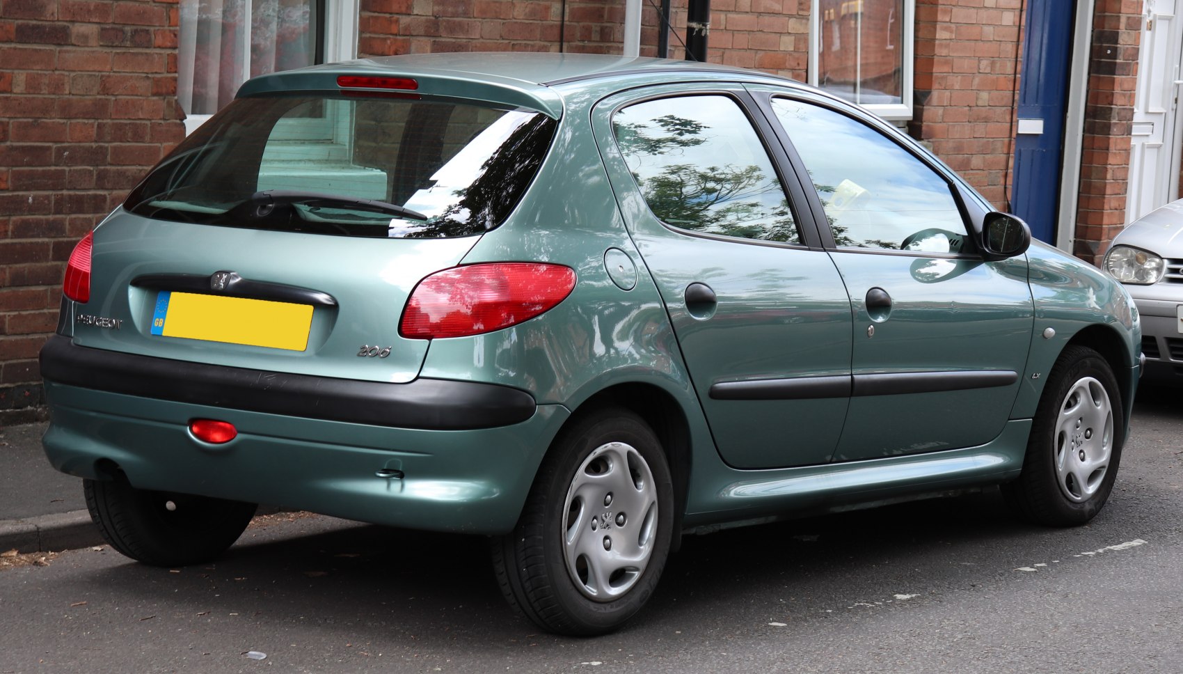 Rear side view of compact hatchback with distinctive taillights and wheel design