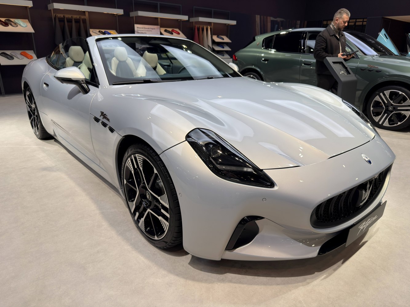 Front view of convertible with distinctive headlights and stylish wheels