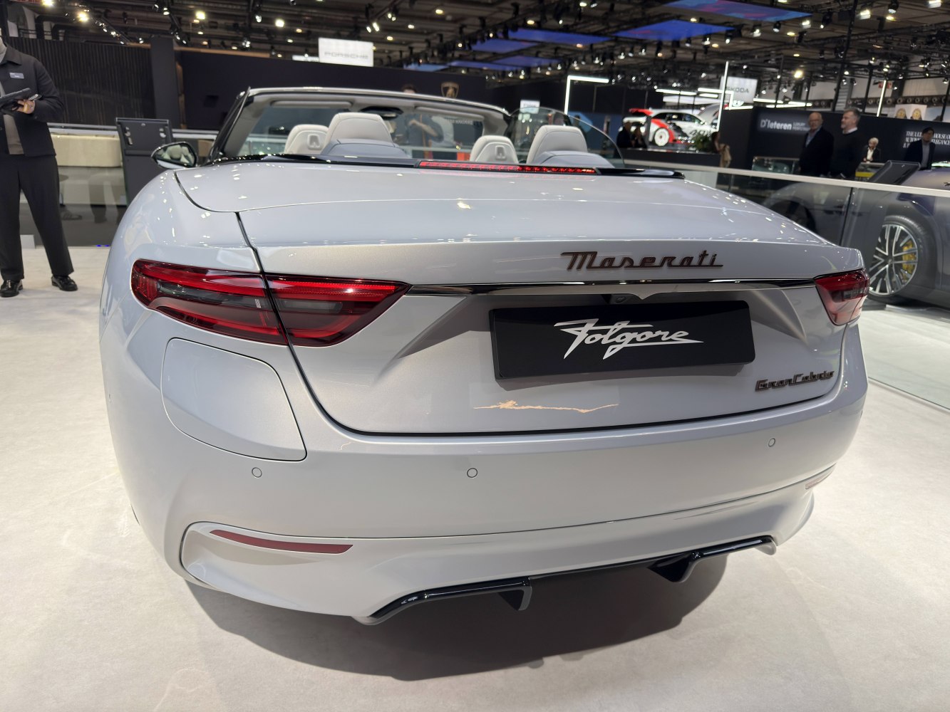 Rear view of a luxury convertible with sleek LED tail lights and dual exhaust