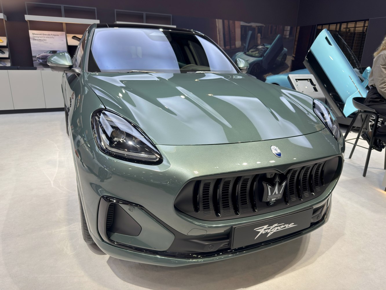 Close-up on aggressive LED headlights and vertical grille
