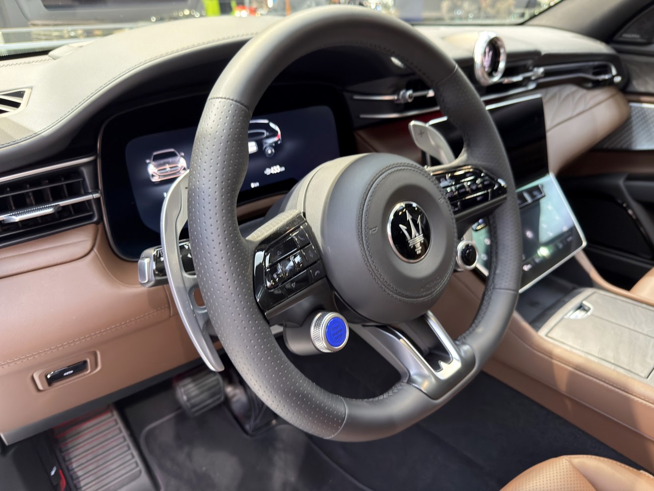 Digital instrument cluster with multi-function steering wheel and premium interior materials