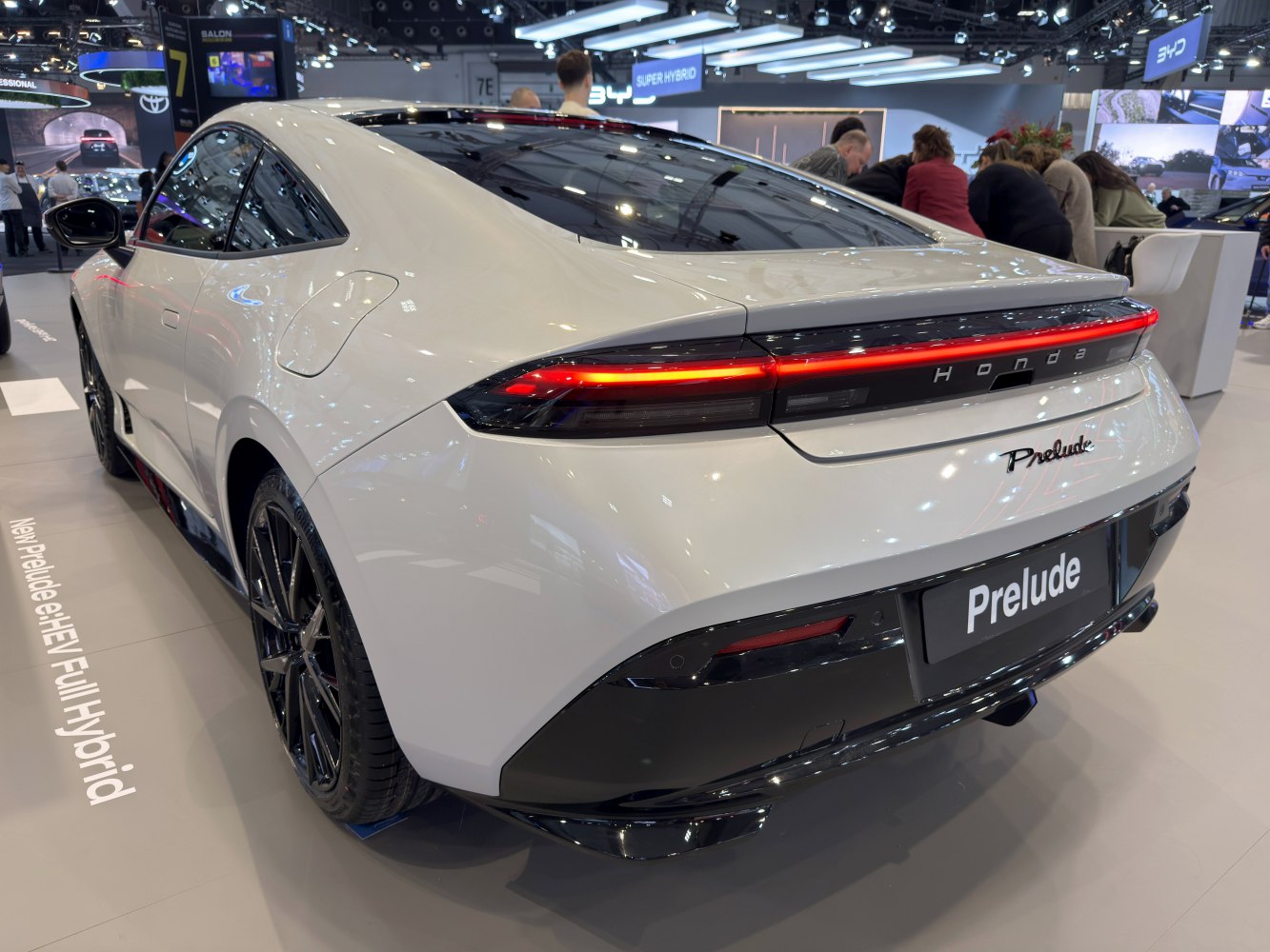 Sleek rear with a continuous LED light bar and black diffuser.