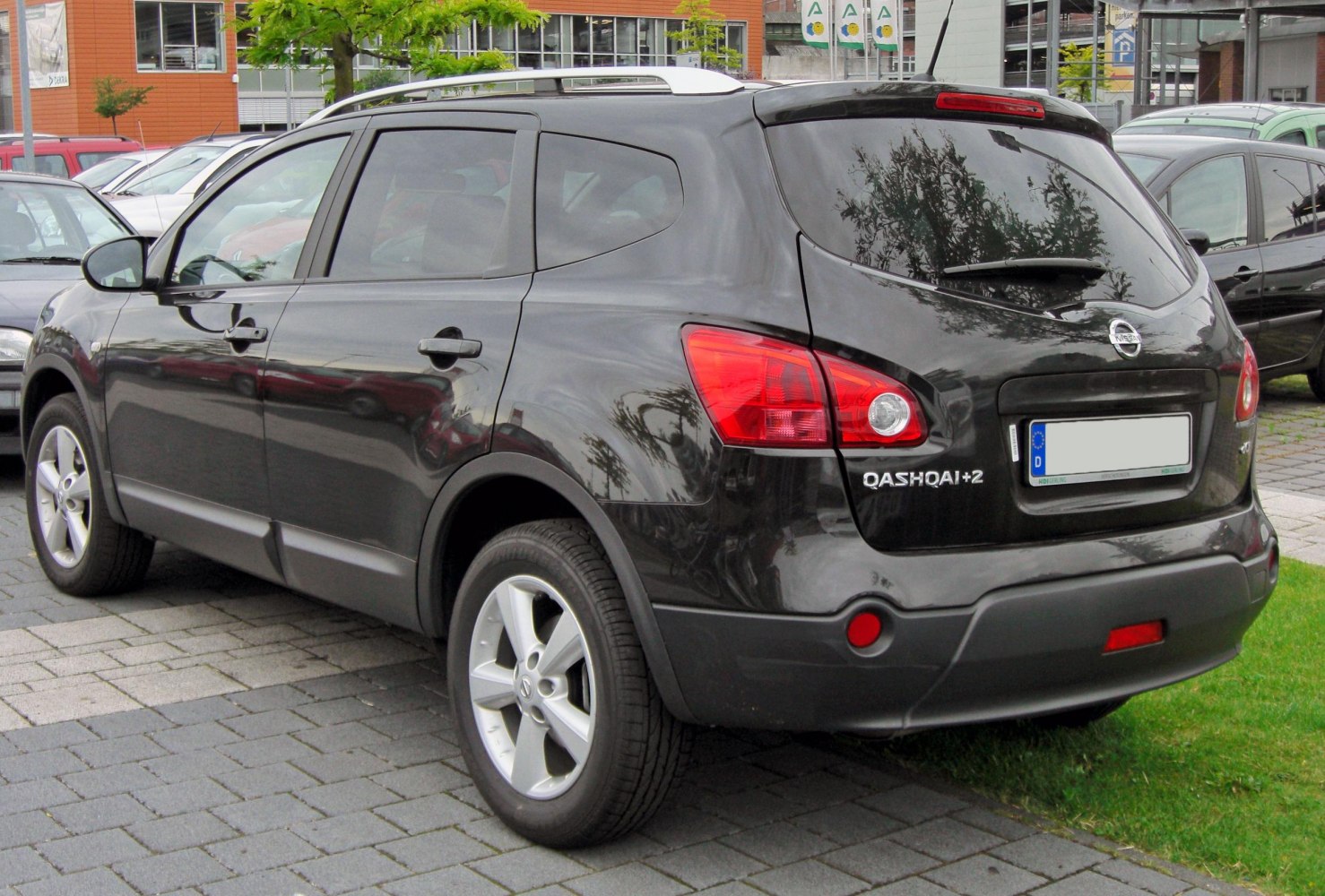 Rear side view of black compact SUV with distinct taillights and alloy wheels