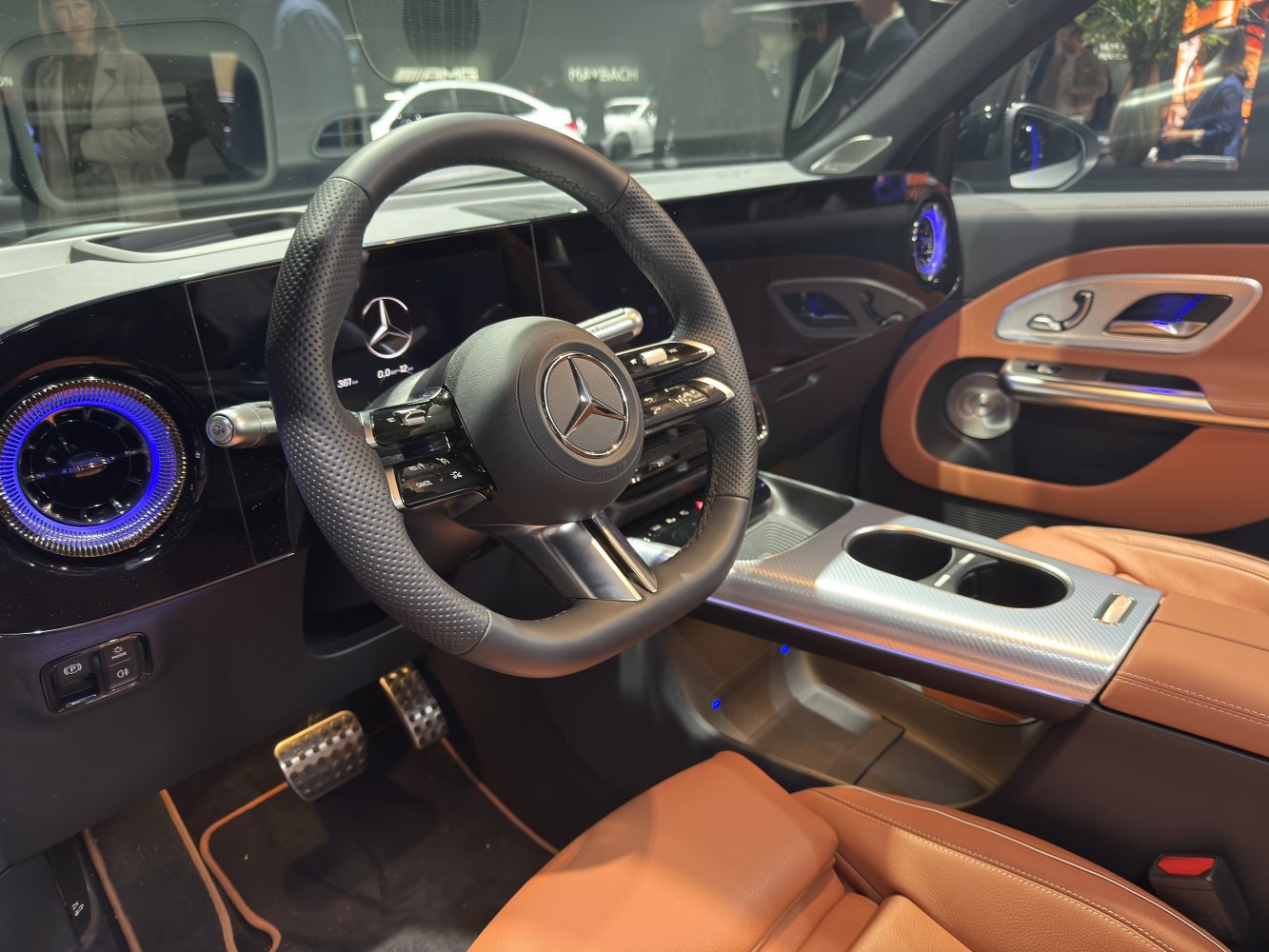 Luxury interior with digital dashboard, ambient lighting, and leather seats