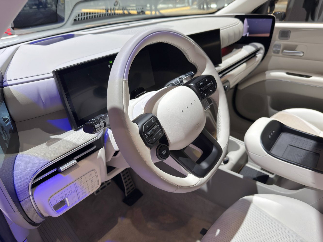Minimalist steering wheel with dual control buttons and digital dashboard