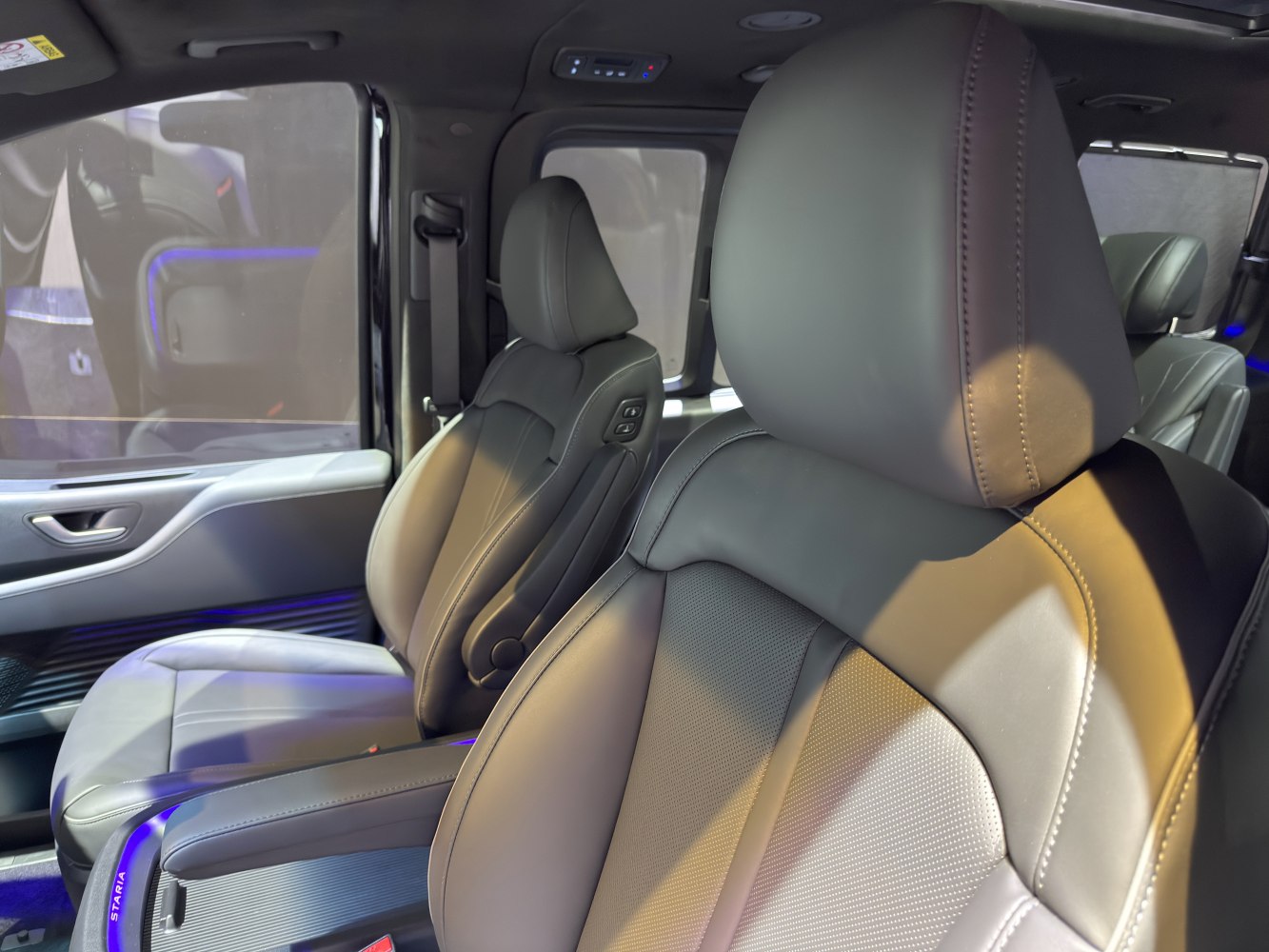 Premium leather seats with modern ambient lighting in SUV van interior