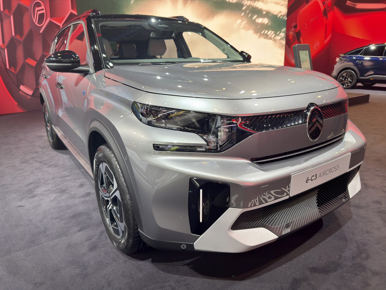 Front view of compact SUV with sleek LED headlights and bold grille