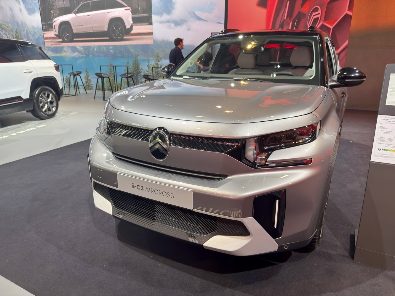 Front view with sleek LED headlights and futuristic grille design.