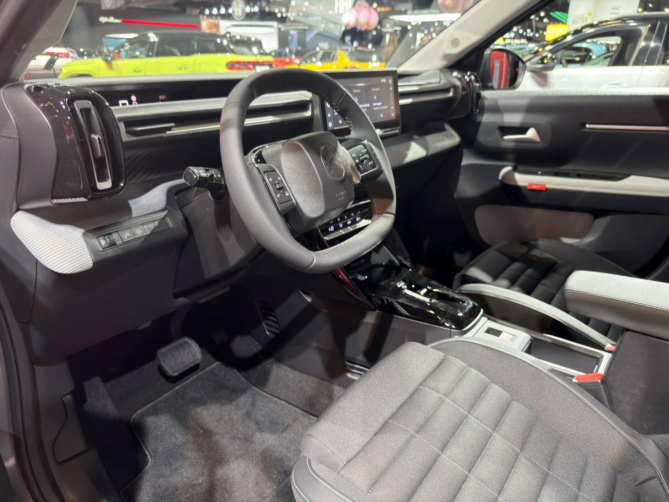Modern dashboard and multifunction steering wheel inside an SUV