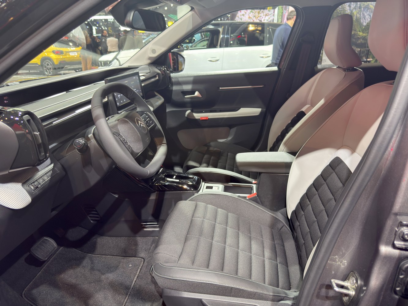 Modern dashboard and comfortable front seats inside a car