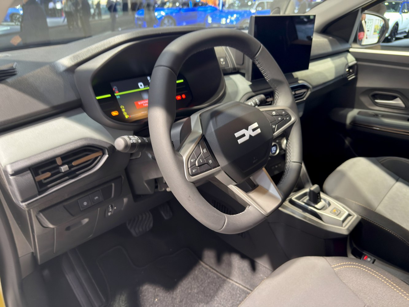 Modern steering wheel with controls and digital dashboard display