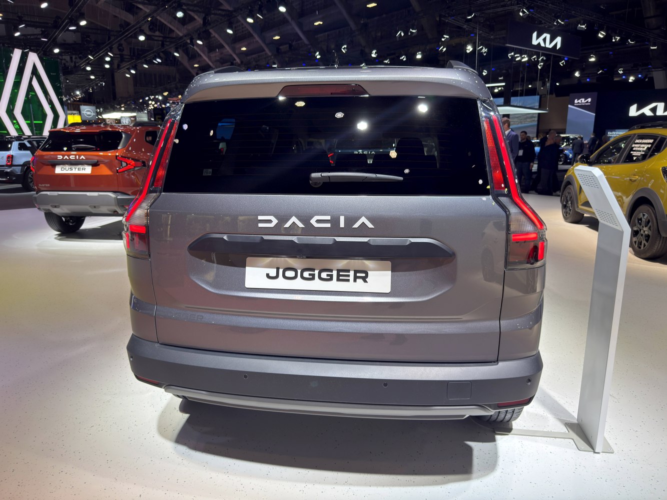 Rear of a vehicle with vertical multi-segment LED tail lights and rear hatch handle